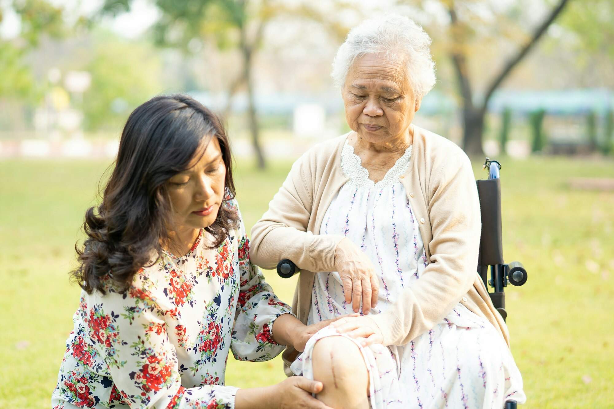 Asian senior woman patient on wheelchair in park, healthy strong medical concept.